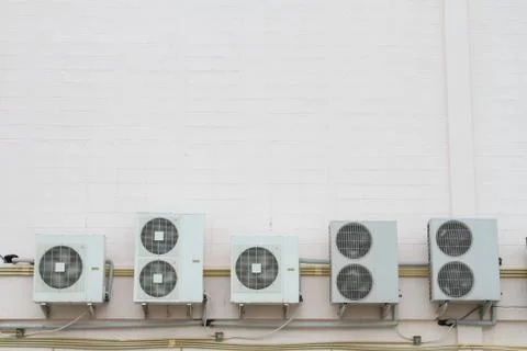 Five air condensing unit out side of wall Stock Photos