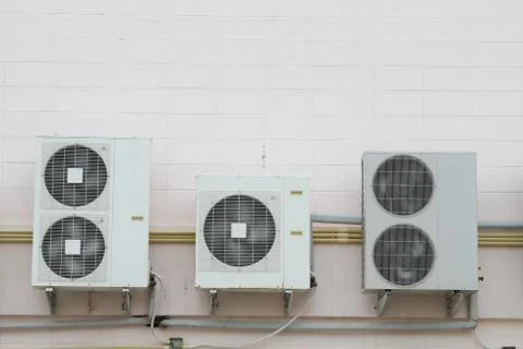Five air condensing unit out side of wall Stock Photos