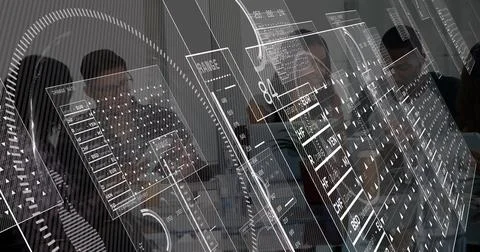 Five analysts analyzing data leaning over laptops in meeting room, with floating 库存照片
