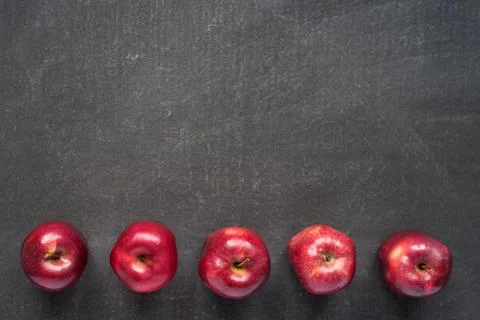 Five apples on painted board Stock-Fotos