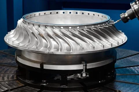 Five-axis milling machine makes turbine wheel at plant Stock Photos