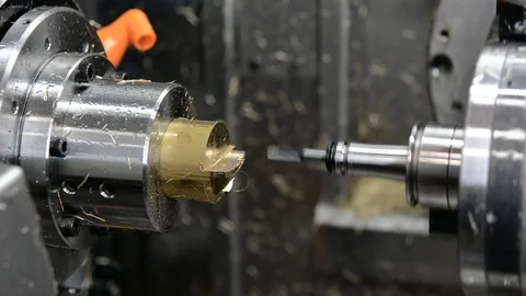 Five axis precision CNC machine tool milling brass on different angles. Stock Footage 121946702