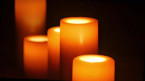 Five big candles in darkness close up shot Video stock 68609958