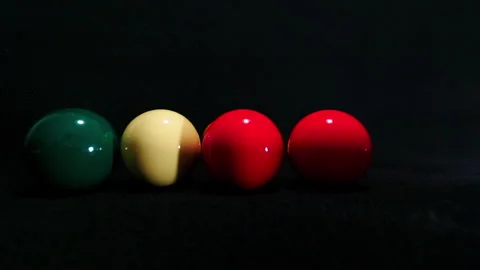 Five billiard balls being hit with a white ball Stock Footage 247299670