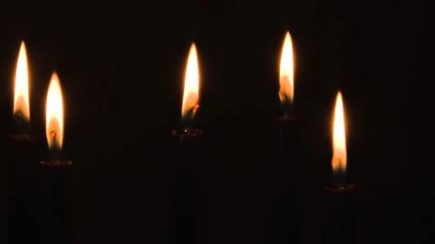Five Black Candles Burning in Dark Room Orange Flames 스톡 동영상 188352294