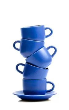 Five blue ceramic coffee cups placed one onto antoher. Stock Photos