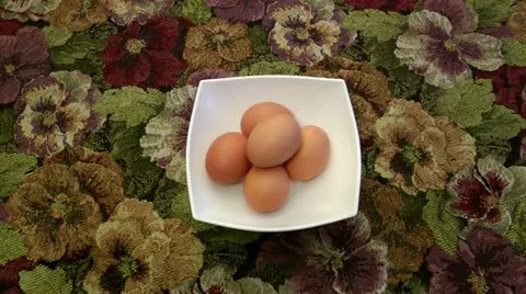 Five boiled eggs for food. The person cleans the first egg from a shell Stock Footage