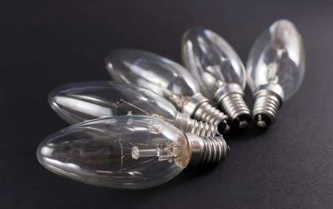 Five Broken Lightbulbs on Black Background Stock Photos