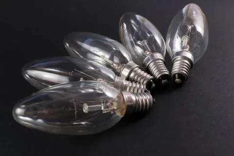 Five Broken Lightbulbs on Black Background Stock Photos