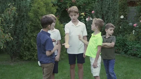 Five brothers put hands one on another in the garden Vidéo 80041983