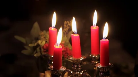 Five burning candles on the holiday table. Stock Footage 75538675