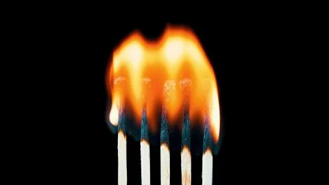 Five burning matches on a black background Stock Photos