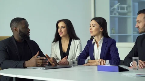 The five business people talking at the table Stock Footage 109513679