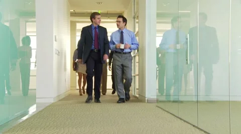 Five business people walking down hallway 库存影片 10771454
