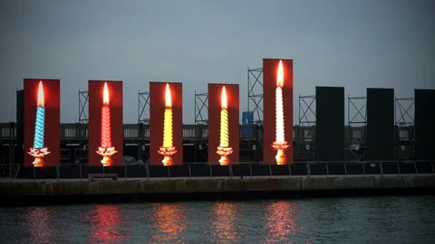 Five candles burning on dark sky background Stock Footage 85662496