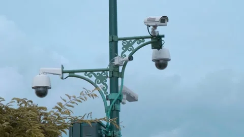 Five CCTV and face recognition cameras attached to a green street pole  Stock Footage 308893037