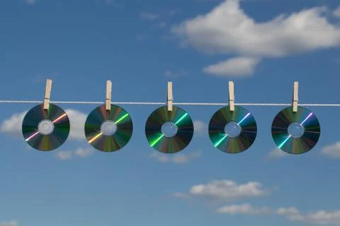 Five cds on a clotheslines Stock Photos