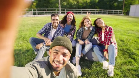 Five cheerful multiracial students friends smiling and rejoicing as they pose Stock Footage 283842692