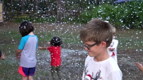 Five children play in pretend soap snow Stock Footage 167072972