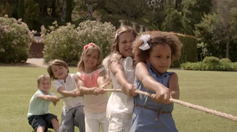 Five children pulling rope having tug of... | Stock Video | Pond5