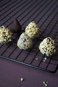 Five chocolates on an iron grate Fotos Stock
