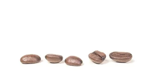 Five coffee beans dark roasted isolated on white background Stock Photos