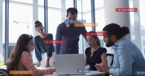 Five colleagues leaning over laptop receiving notifications, overlays appearing 스톡 동영상 334184938