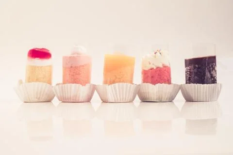 Five coloful cute small cakes in vintage tone Stock Photos