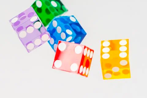 Five color dice over white Stock Photos