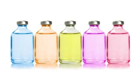 Five colored bottles with essential oils Stock Photos