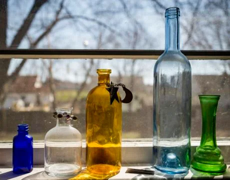 Five colored bottles Stock Photos