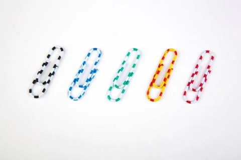 Five colored paper clips Stock Photos