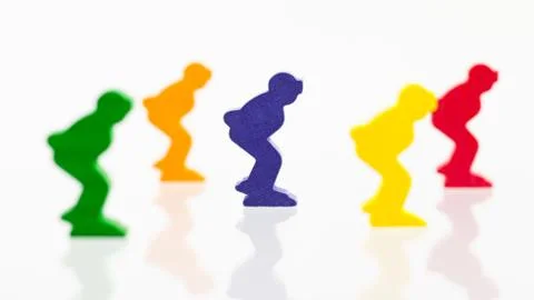 Five colored pawns isolated on a white background Stock Photos