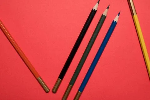 Five colored pencils on the background Stock Photos