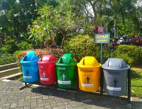 Five colored trash cans provided at Adipura Park, Bontang City Stock Photos