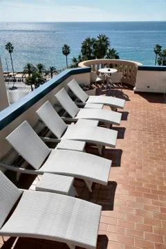 Five deckchairs Stock Photos