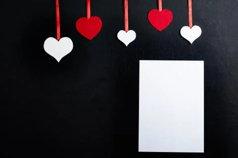 Five decorative hearts of different sizes and colors. Decorative hearts tied  Stock Photos