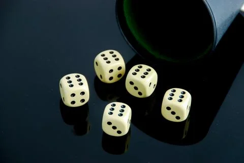 Five dice all show high scores of six dots Stock Photos