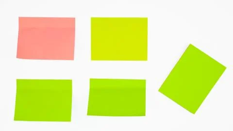 Five different colored paper sticky notes displayed before a white background Stock Photos