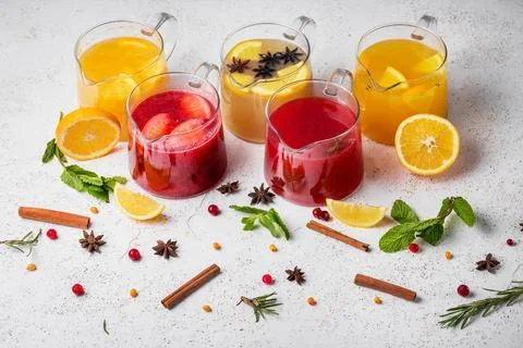 Five different fruit teas in glass teapots Stock Photos