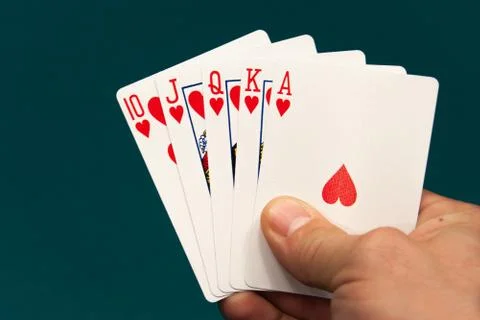 Five different play cards in a hand Stock Photos