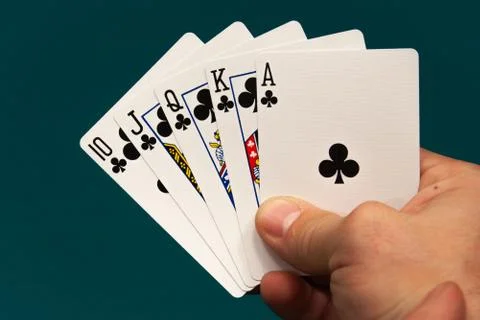 Five different play cards in a hand Stock Photos