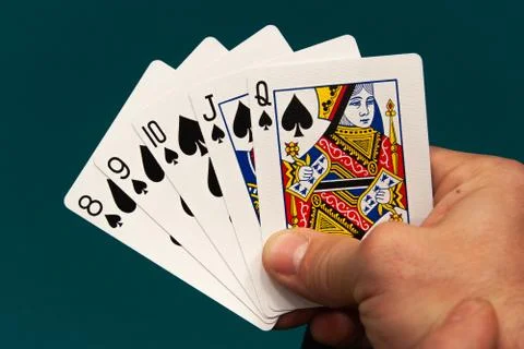 Five different play cards in a hand Stock Photos