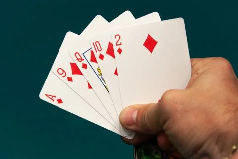 Five different play cards in a hand Stock Photos