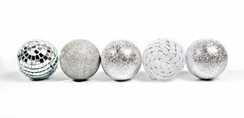 Five different silver new year balls Stock Photos