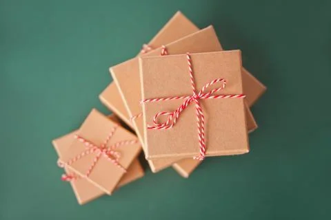 Five different sizes Christmas gift boxes on the green background Stock Photos