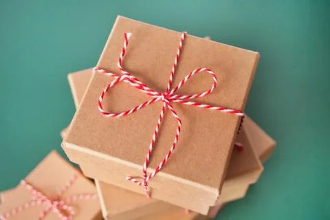 Five different sizes Christmas gift boxes on the green background Stock Photos