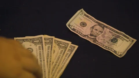 Five Dollar Bill and Five Ones Stock Footage 94159789