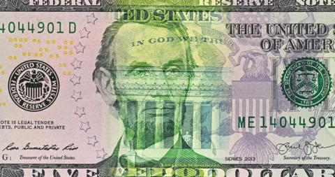 Five Dollar Bill Under Moving Green Security Light. Video stock 346464570
