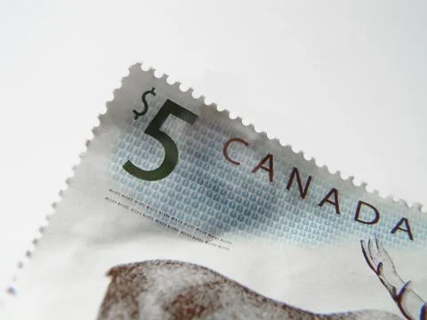 Five dollar stamp Stock Photos